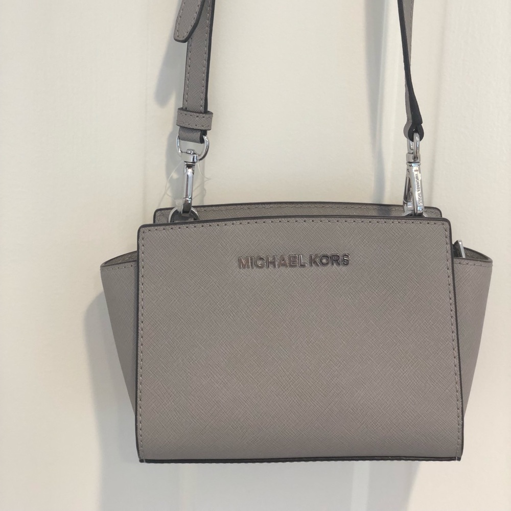 Mini Michael Kors “Selma” crossbody bag in grey.